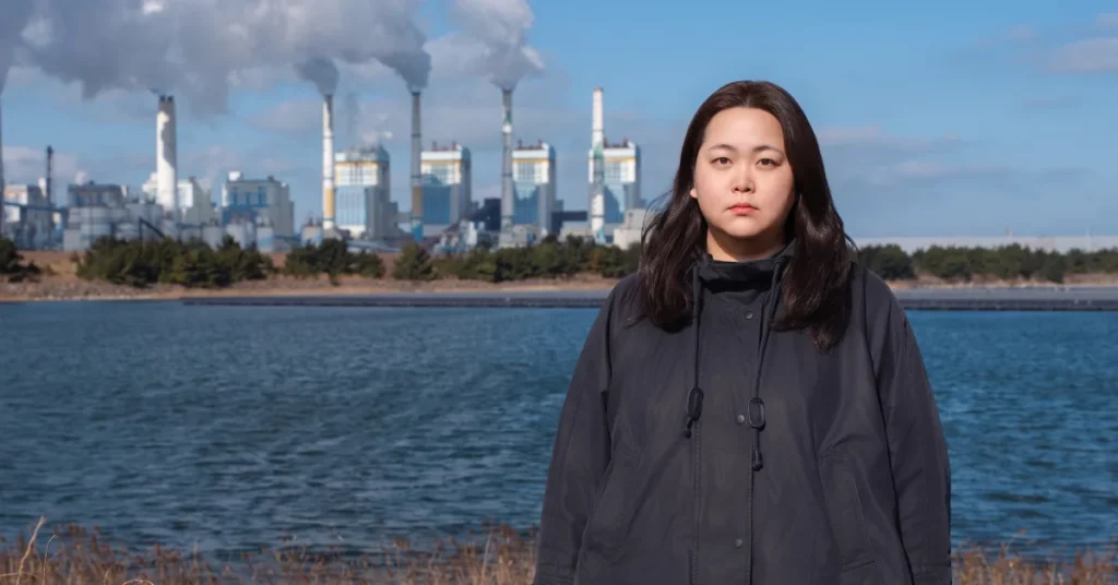 Borim Kim founder of Youth 4 Climate Action in front of Taean coal power plant in South Korea