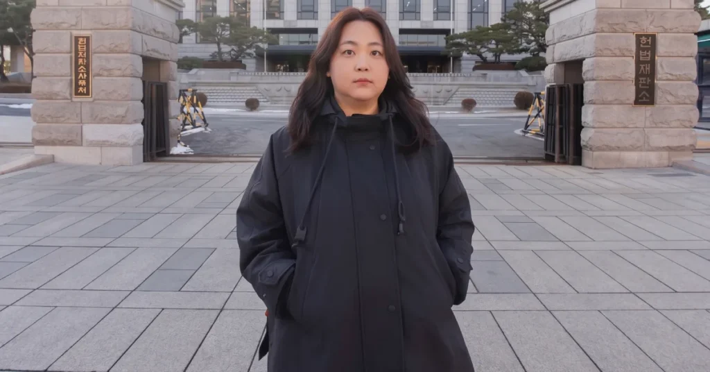 Borim Kim standing in front of the Constitutional Court of Korea gates in Seoul