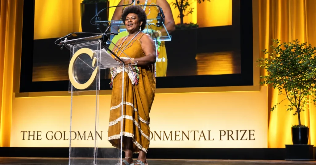 Theonila Roka Matbob speaking at the podium during the Goldman Environmental Prize ceremony
